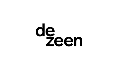 Logo of Dezeen with the word "dezeen" in lowercase black letters on a white background, embodying the understated elegance often found in luxury resorts like those of Auberge Resorts.