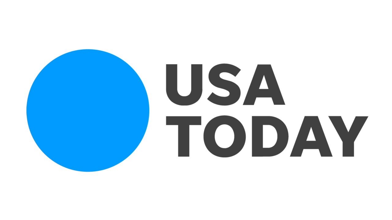 USA Today logo with a large blue circle on the left and the text "USA TODAY" in black on the right, reminiscent of the serene ambiance at Marie Selby Botanical Gardens.